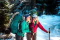 Two smiling women in a winter hike