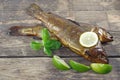 Smoked trout on wooden background Royalty Free Stock Photo