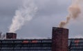 Two smoking chimneys Royalty Free Stock Photo