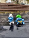 Wild Smurf and Hefty Smurf Figurines Outdoors Royalty Free Stock Photo