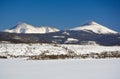 Two Snow Covered Mountain Peaks on a Cold Winter Day Royalty Free Stock Photo