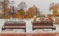 Two snow-covered steel benchs