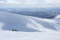 Two snowboarders on the mountain in polar russian ski resort