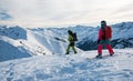 Two snowboarders on the mountain top