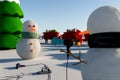 Snowmen duelling with hot guns or hair-dryers plugged into electric socket