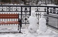 Two snowmen, Park, bench, winter, snow Royalty Free Stock Photo