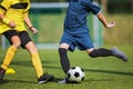 Two soccer players compete in a duel. Footballers kicking ball Royalty Free Stock Photo