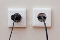 Two sockets with plugs inside Royalty Free Stock Photo