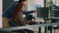 Two software coders analyzing source code on computer and laptop screen Royalty Free Stock Photo