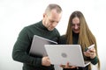 Two software developers analyzing source code looking at green screen chroma key mockup with coworker sitting at desk