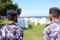 Two Soldiers Watch Traditional Music Performed in Oman