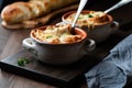 Two soup crocks filled with French onion soup topped with crusty bread and melted cheese. Royalty Free Stock Photo