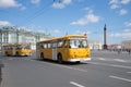 Two Soviet city buses LiAZ-677 on the background of the Palace Square. The third annual retro-transport parade in St. Petersburg