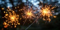 Two sparklers positioned next to each other, emitting bright flames