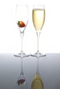 Two sparkling wine glasses with a strawberry Royalty Free Stock Photo