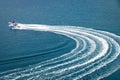 Two speedboat runs fast in the open sea and leaves the engine`s wake in the water Royalty Free Stock Photo