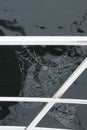 Two spider webs on the railing of a boat Royalty Free Stock Photo