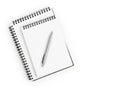 Two spiral notebooks with a pen ready for note-taking Royalty Free Stock Photo