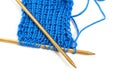 Two spokes with knit blue woolen cloth isolated macro Royalty Free Stock Photo