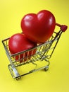 Spongy red hearts in shopping cart Royalty Free Stock Photo