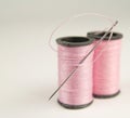 Two Spools of Pink Thread with Needle