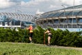 Minsk. Belarus. 08.25.2022.Two sportswomen roller-ski in the park. Roller ski training.