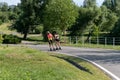 Minsk. Belarus. 09.14.2022. Two sportswomen roller-ski in the park. Roller ski training.