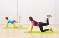 Two sporty girls at fitness club Royalty Free Stock Photo