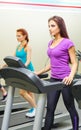 Two sporty girls at fitness club Royalty Free Stock Photo