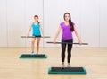 Two sporty girls at fitness club Royalty Free Stock Photo