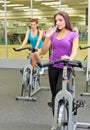 Two sporty girls at fitness club Royalty Free Stock Photo