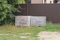 Two square boxes in plastic packaging with paving bricks Royalty Free Stock Photo