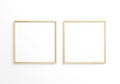 Two square thin wooden frame on white wall. 3d rendering Royalty Free Stock Photo