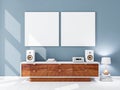 Two square white canvas Mockups hanging on the blue wall Royalty Free Stock Photo