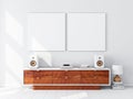 Two square white canvas Mockups hanging on the wall, hi fi micro system on bureau Royalty Free Stock Photo