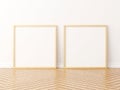 Two square wooden frame mockup on the wooden floor. 3d rendering Royalty Free Stock Photo