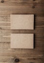 Two stack of blank craft business cards on wooden background Vertical