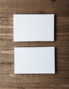 Two stack of blank white business cards on wooden background Vertical Royalty Free Stock Photo