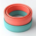 Two Stacked Circular Objects Coral And Teal Color With Silver Accents Isolated On White Royalty Free Stock Photo