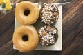 Two stacked sugared donuts and muffins Royalty Free Stock Photo
