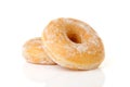 Two stacked sugared donuts over white background Royalty Free Stock Photo