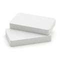 Two stacked white textured rectangular blocks placed against a plain background Royalty Free Stock Photo