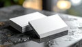 Two Stacks of Blank White Business Cards on a Dark Textured Surface Keywords: business cards, blank, white, stack Royalty Free Stock Photo