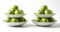 Two stacks of green apples in white bowls Royalty Free Stock Photo