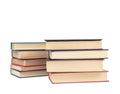 Two stacks of hardback books on a white background. Royalty Free Stock Photo