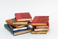 Two stacks of old books with ancient bindings Royalty Free Stock Photo