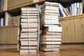 Two stacks of old books tied with twine on floor Royalty Free Stock Photo