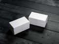 Two Stacks of white business cards on black wooden table Royalty Free Stock Photo