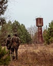 Two stalkers on abandoned farm in the Chernobyl Exclusion Zone Royalty Free Stock Photo