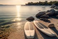 Two Stand Up Paddle surf boards, or SUP boards on a seashore in Croatia, golden hour, sunset. AI generative, image generated with
